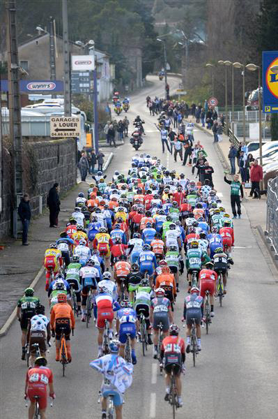 The peloton goes through the feed zone